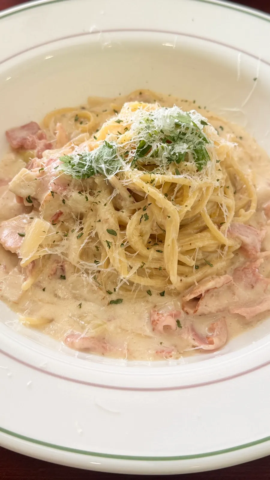 Cream pasta plate loaded with bacon