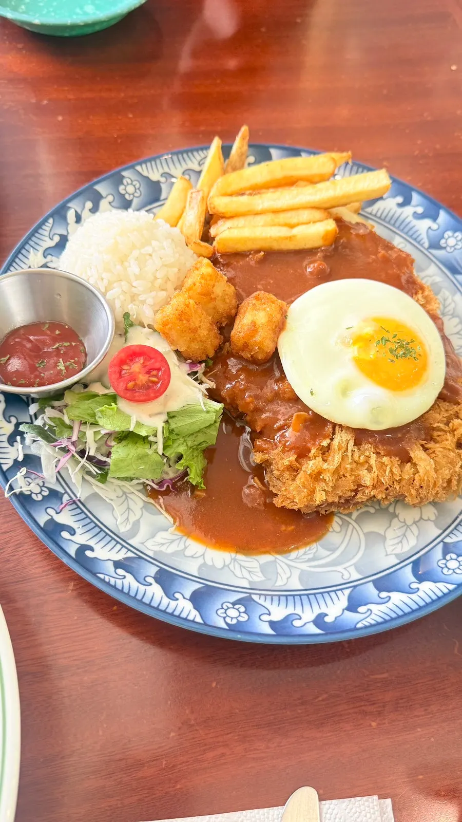 A plate of crispy-fried pork loin cutlet