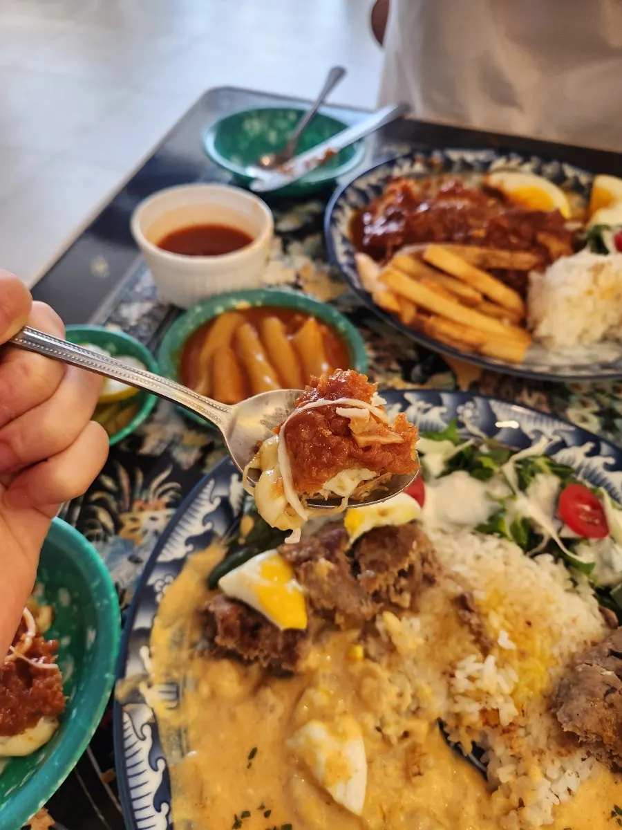 A piece of cheese pork cutlet dipped in spicy sauce