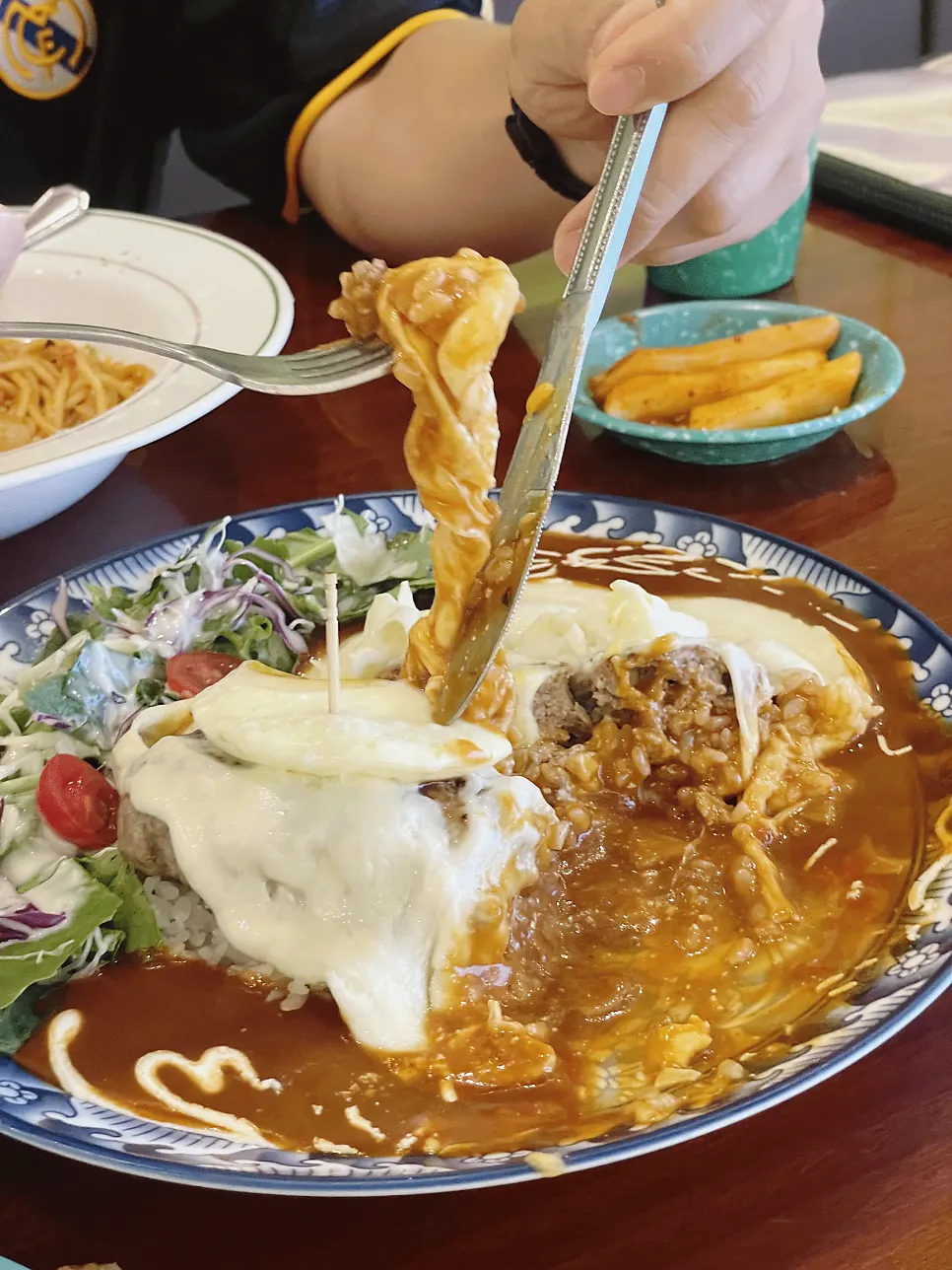 A piece of hamburg steak dipped in sauce