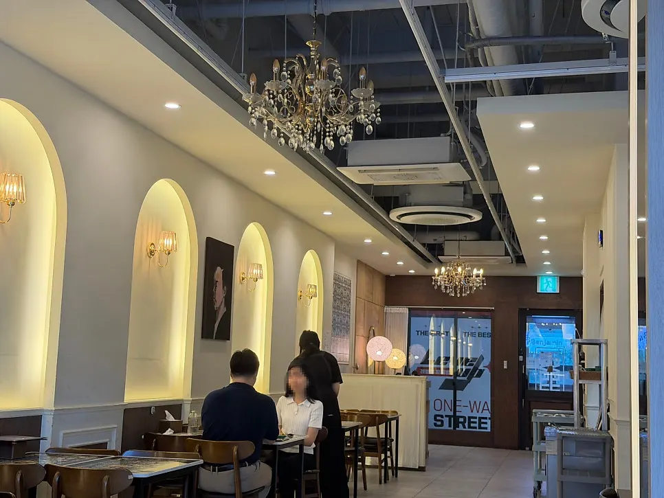 Interior with picture windows and a chandelier