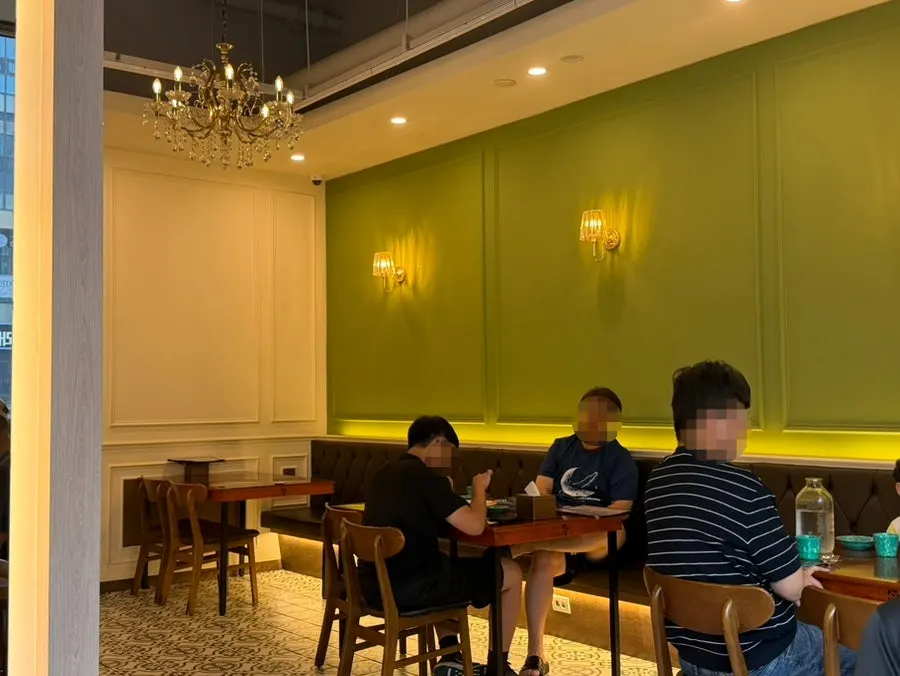 Dining hall split into tables for two and four