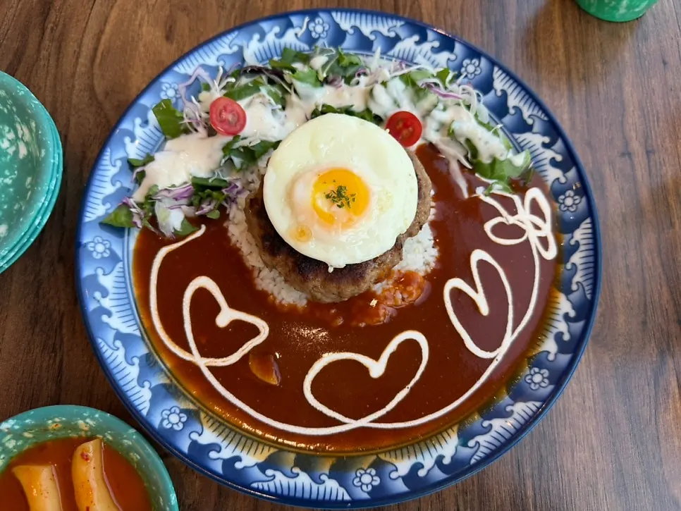 A spread of Jeongssi Hambak, hambak omurice, and bacon bean sprout fried rice
