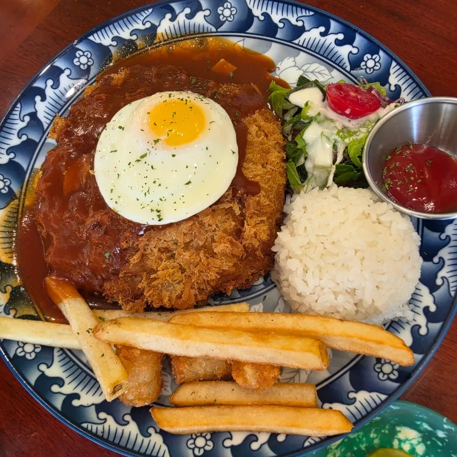 Cheese pork cutlet topped with a soft-boiled egg