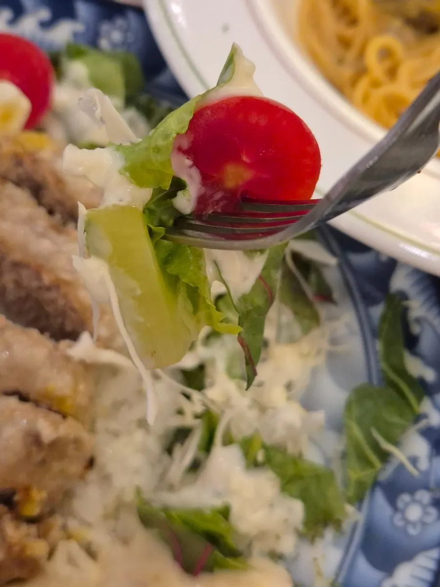Salad served with the garlic cream hamburg