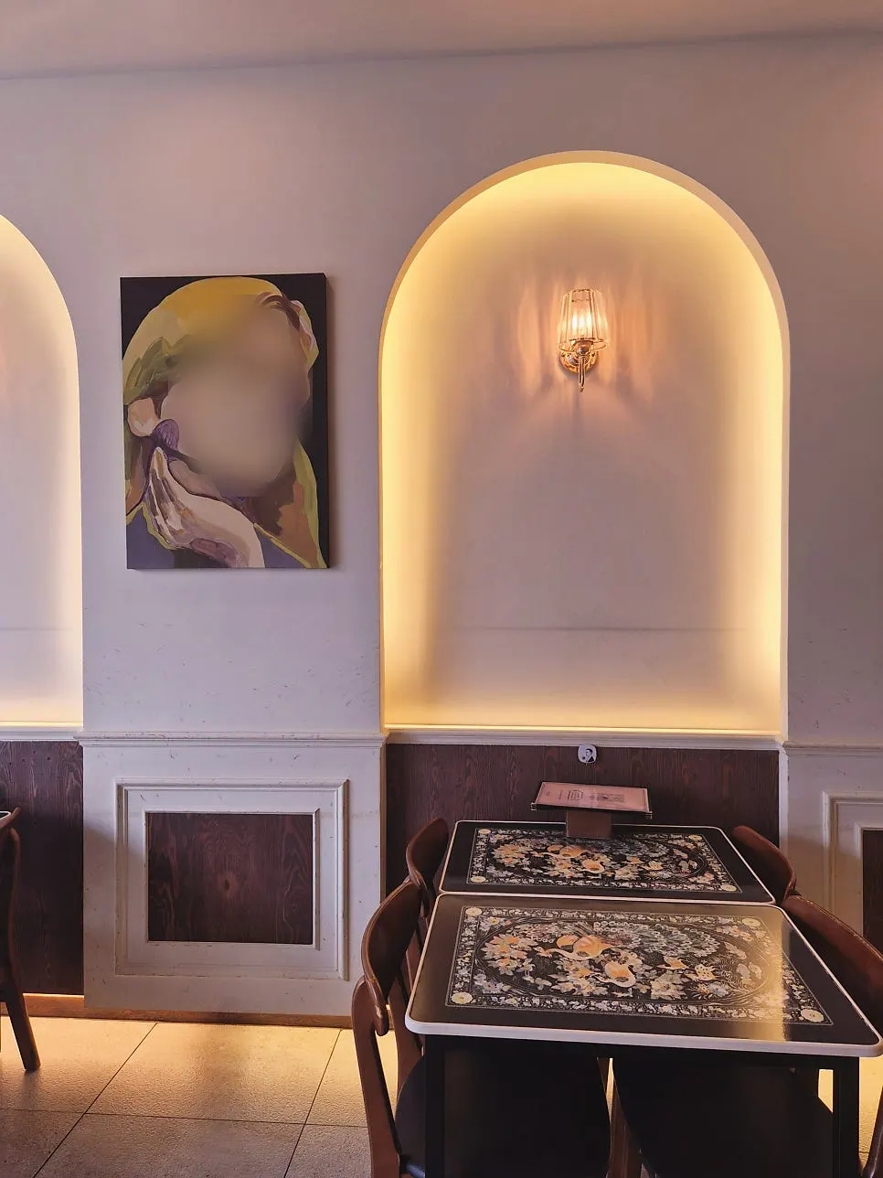Interior of Jeongssi Hambak Baegot Branch with sunlight streaming through a full glass window