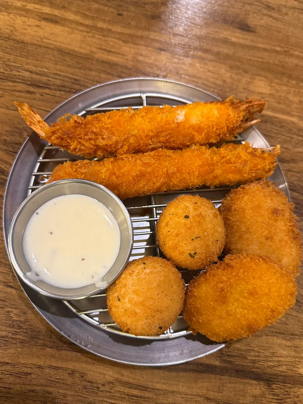A plate of assorted fried sides at Jeongssi Hambak