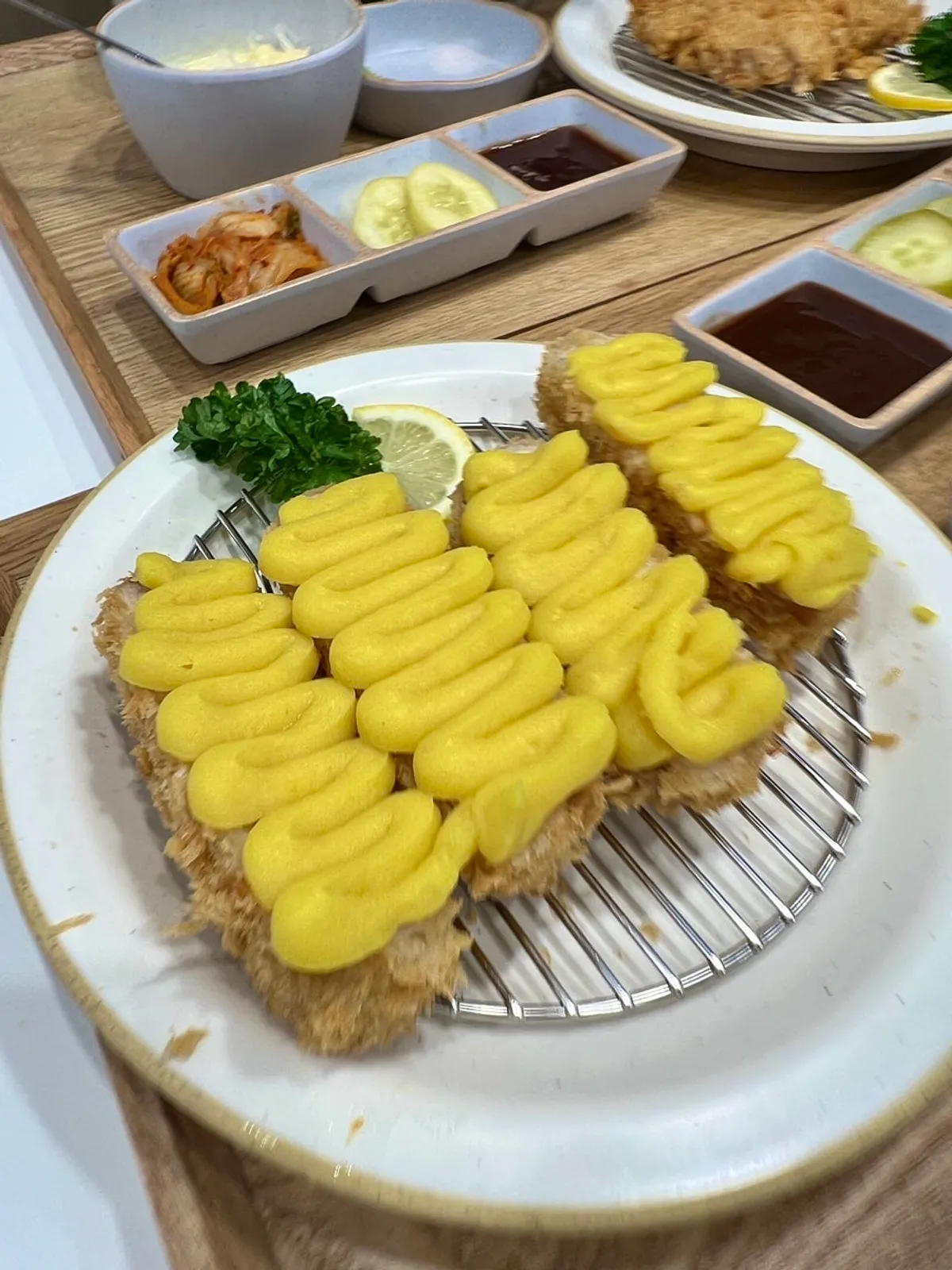 Close-up of tonkatsu piled with sweet potato and cheese