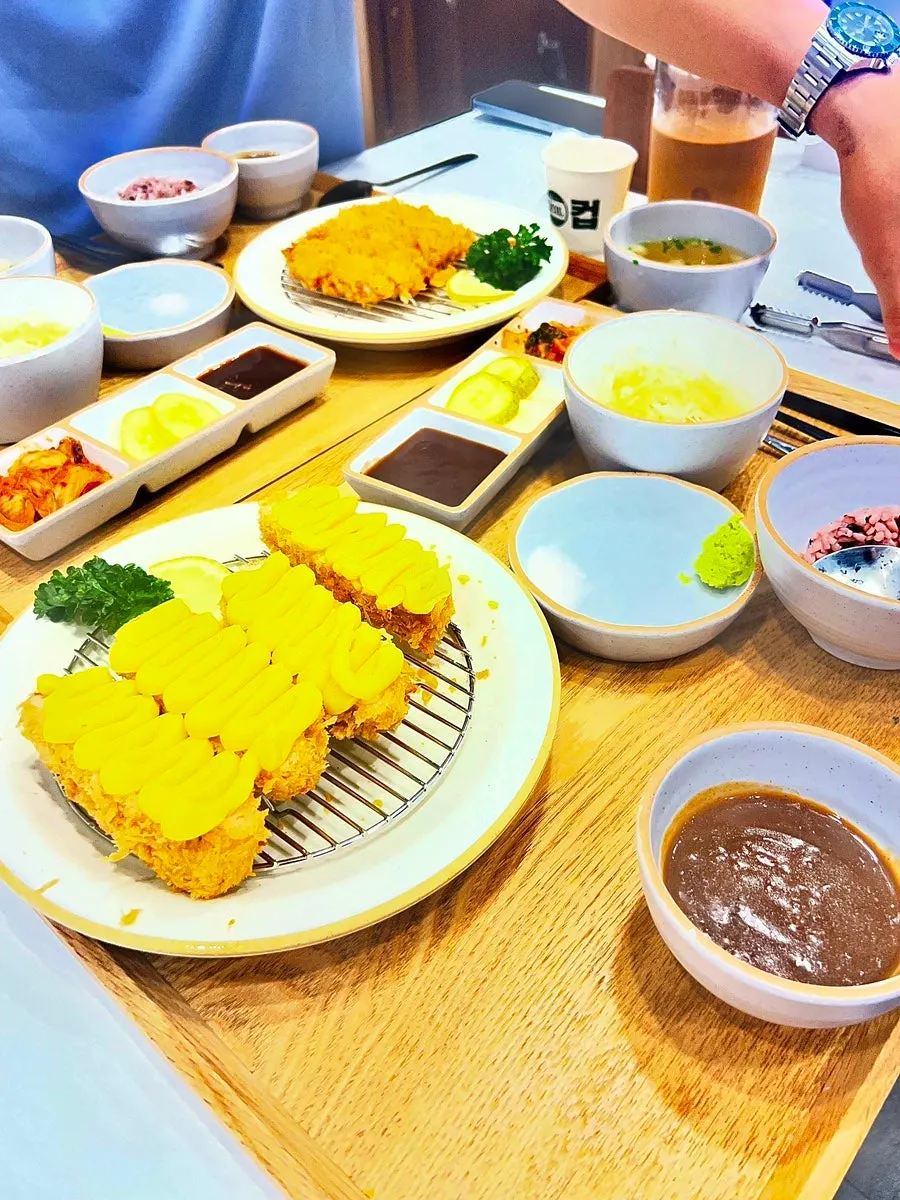 A piece of sweet potato cheese katsu picked up