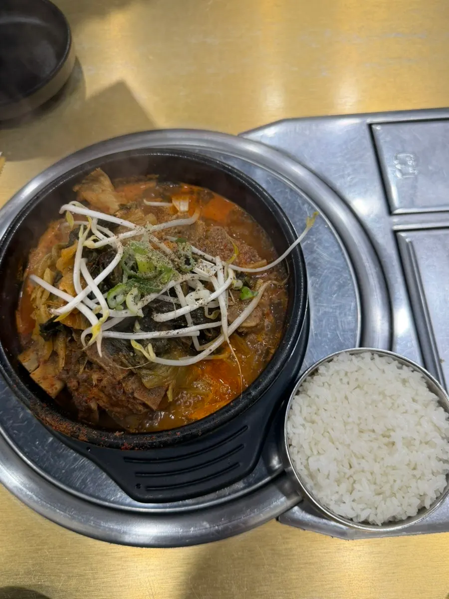 Bone hangover soup set served with a bowl of rice