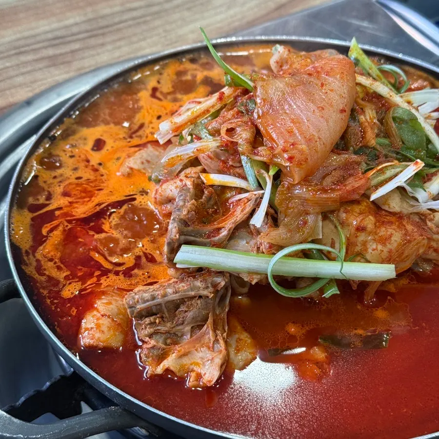 Pot of dakbokkeumtang starting to simmer on the table