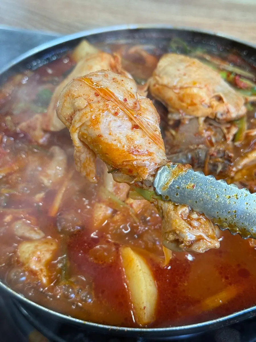 Chicken leg and potato fished out of the pot