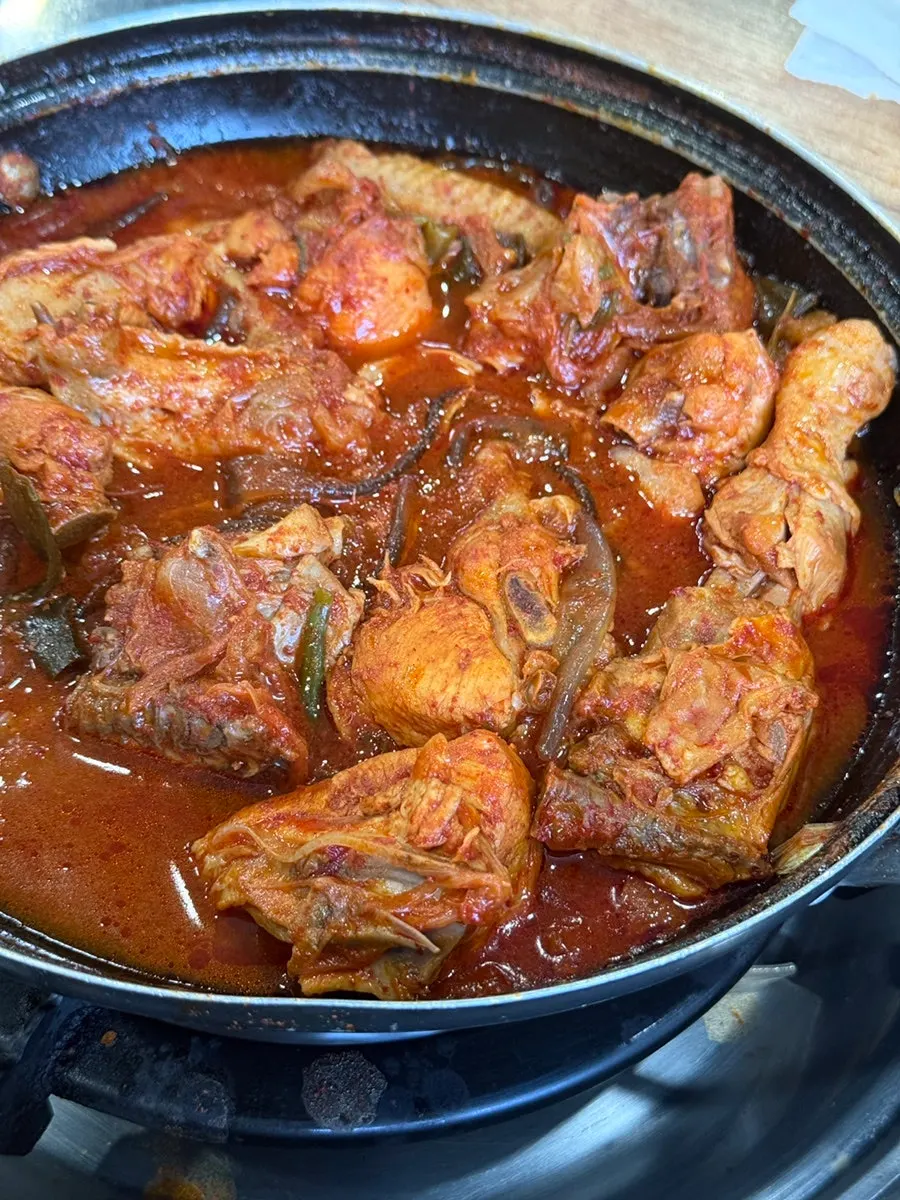 Pot of dakbokkeumtang reduced down to a thick broth