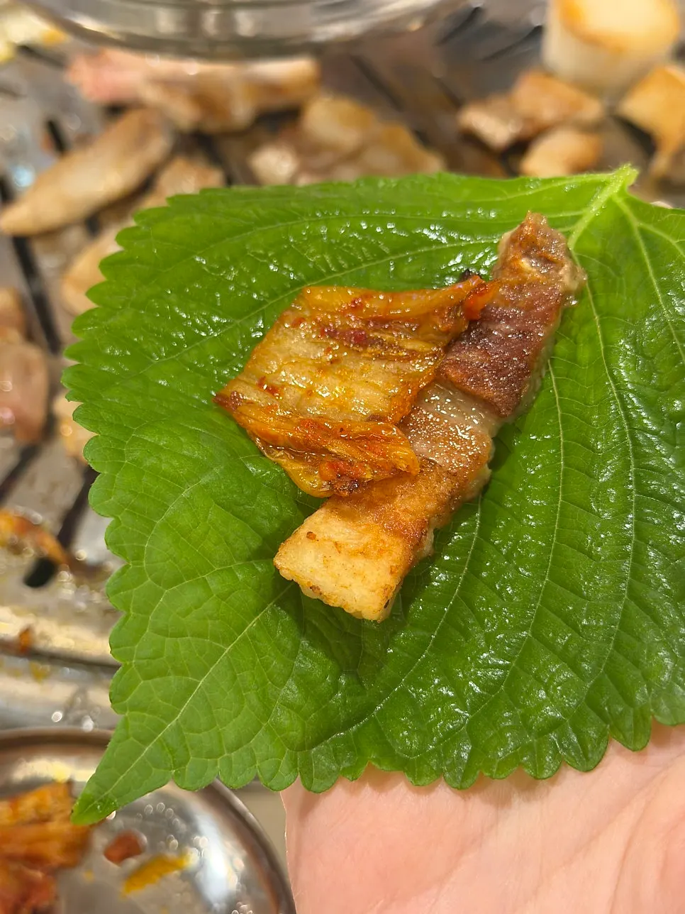 A piece of grilled mukeunji and samgyeopsal together
