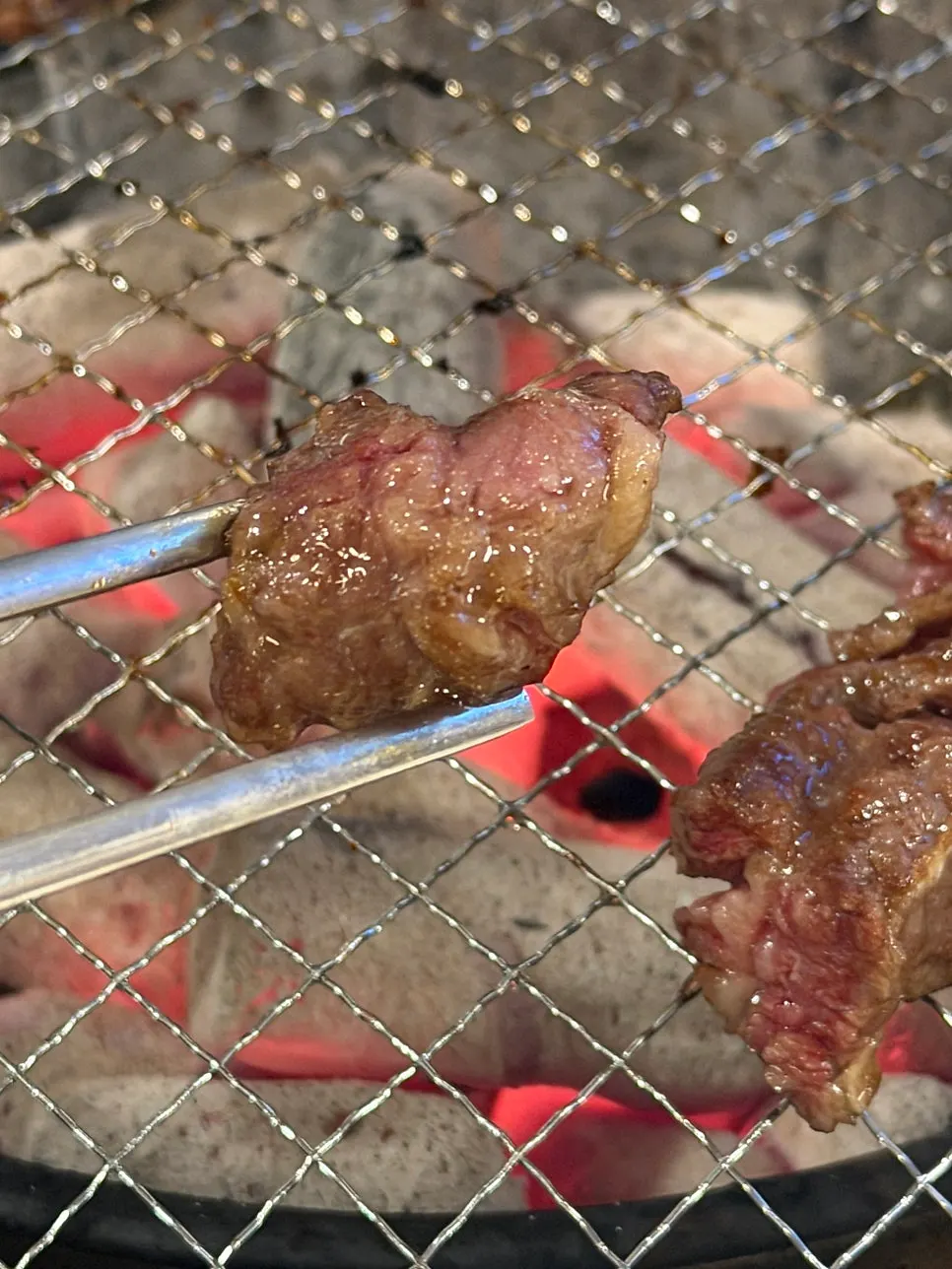 Beef galbi grilled on a fresh grill plate