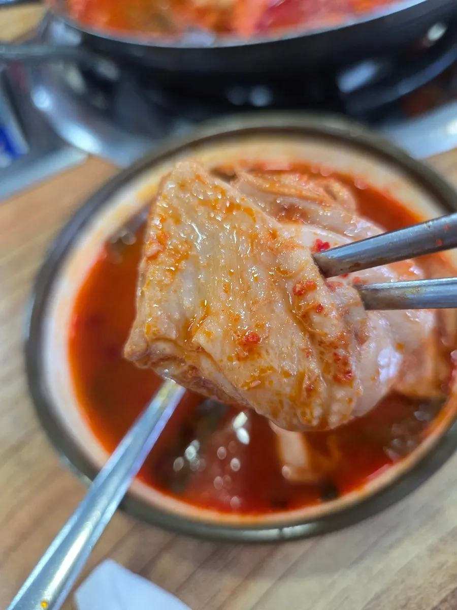 Chicken pieces including drumsticks in the dakbokkeumtang