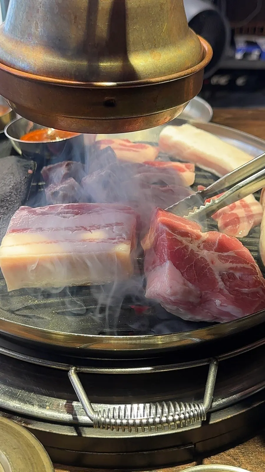 Thick pork belly grilling on the grill plate