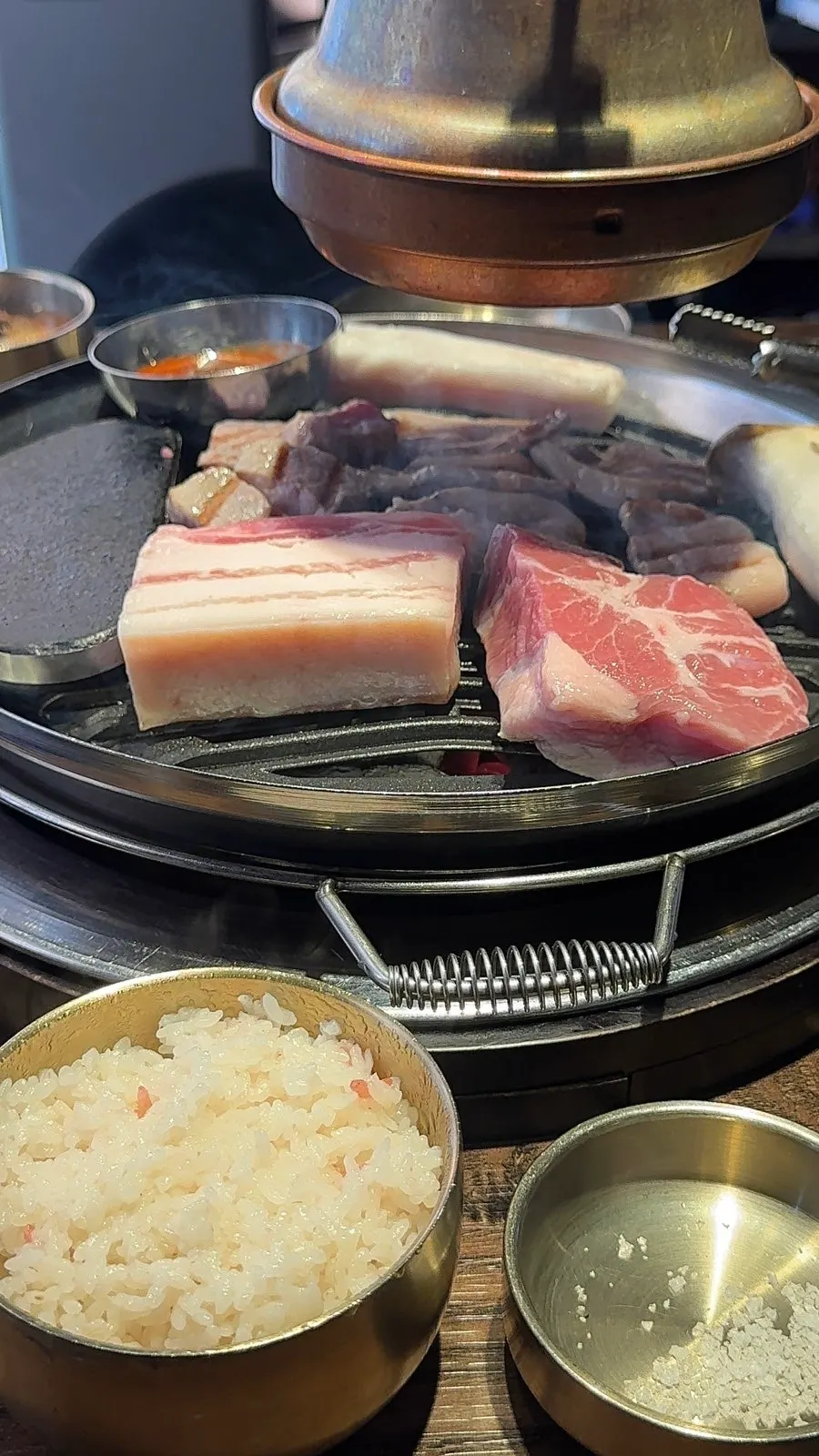 Meat being grilled on the grill plate