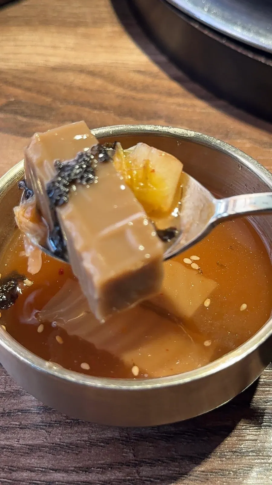 Complimentary minari and vinegar-chili sauce