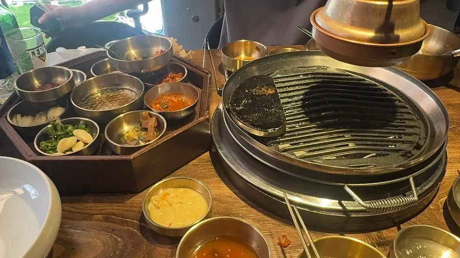 Pork belly wrap topped with minari