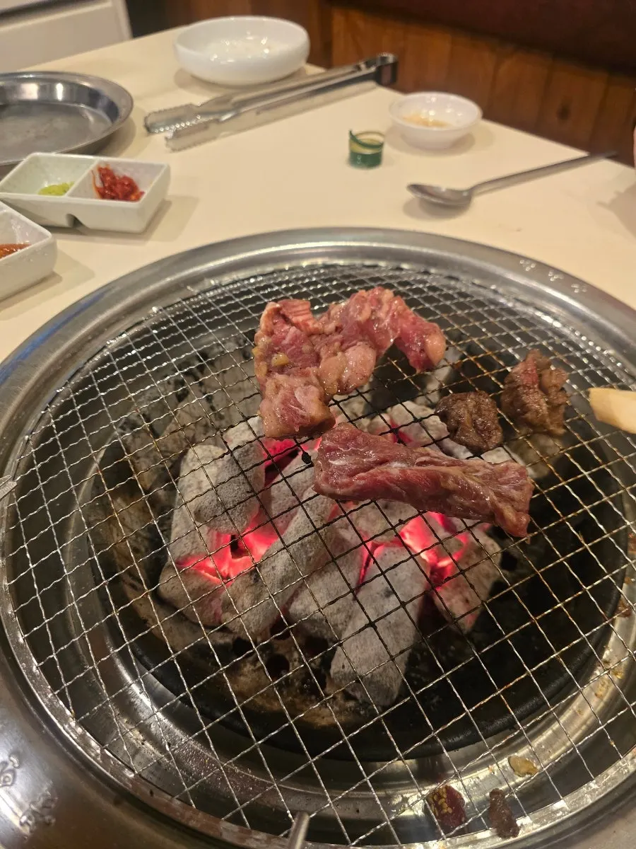 Beef galbi cooking on the grill