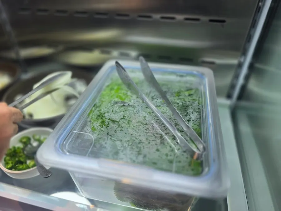 A piece of beef galbi dipped in sauce