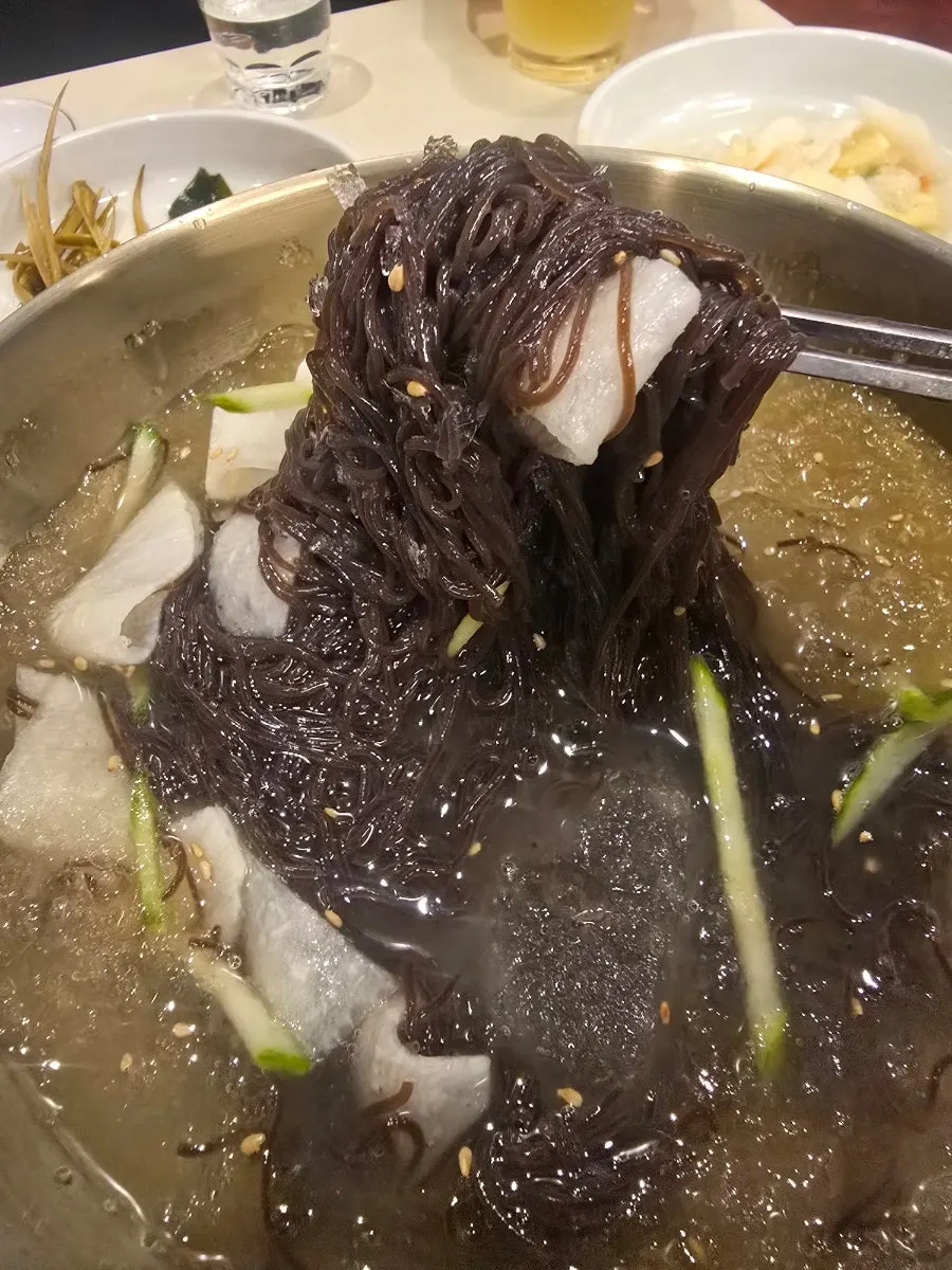 Mul naengmyeon enjoyed alongside the meat
