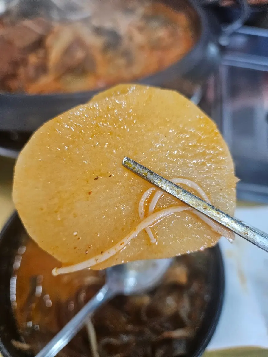 Spicy gamjatang broth with dried radish greens