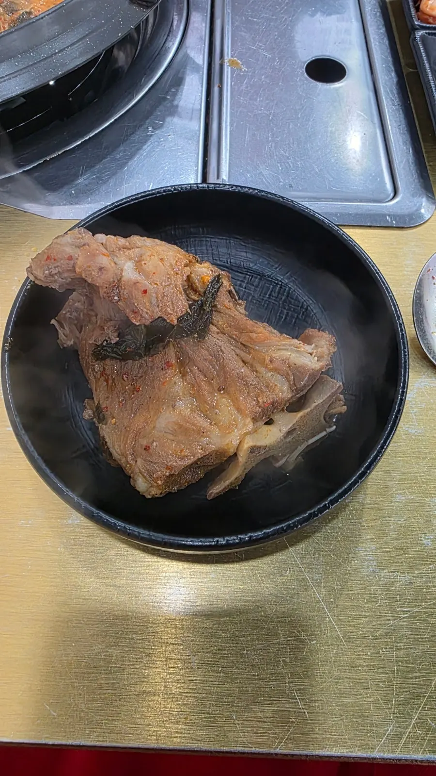 Pork spine meat being pulled apart