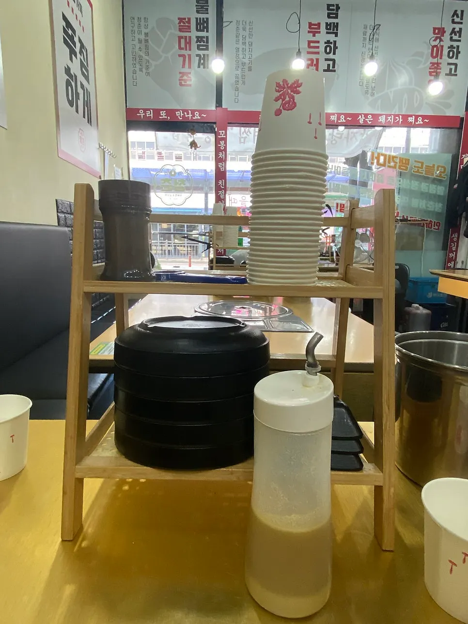 Table setting with small plates, sauce, and cups