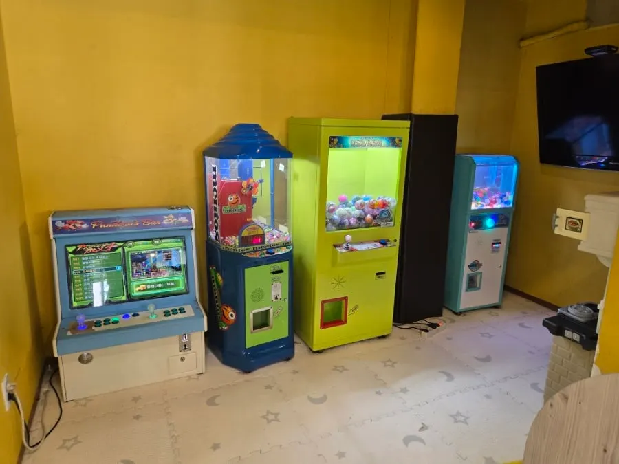 Arcade machines set up in the play room