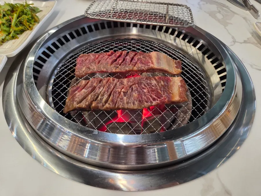 Beef galbi grilling on the grill plate