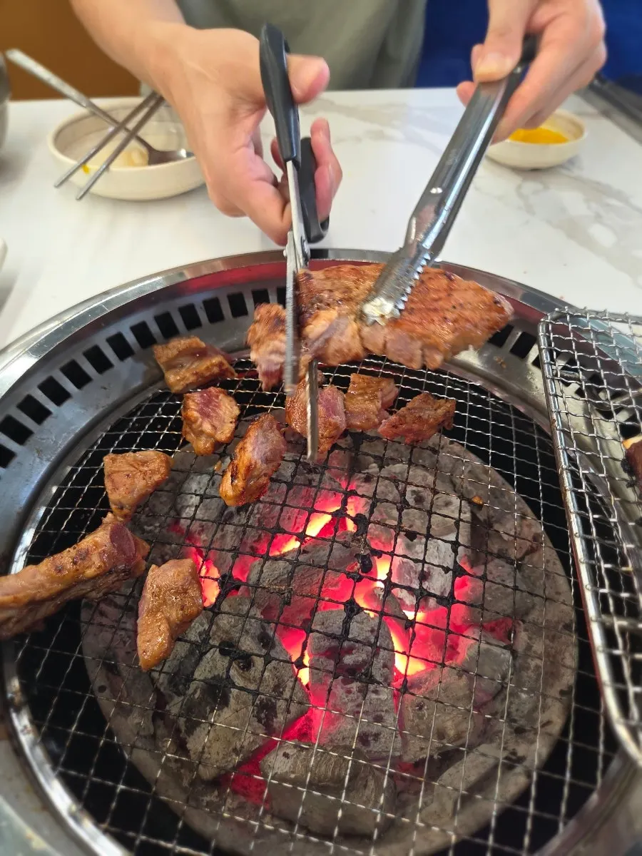 Seasoned pork galbi cooking on the grill