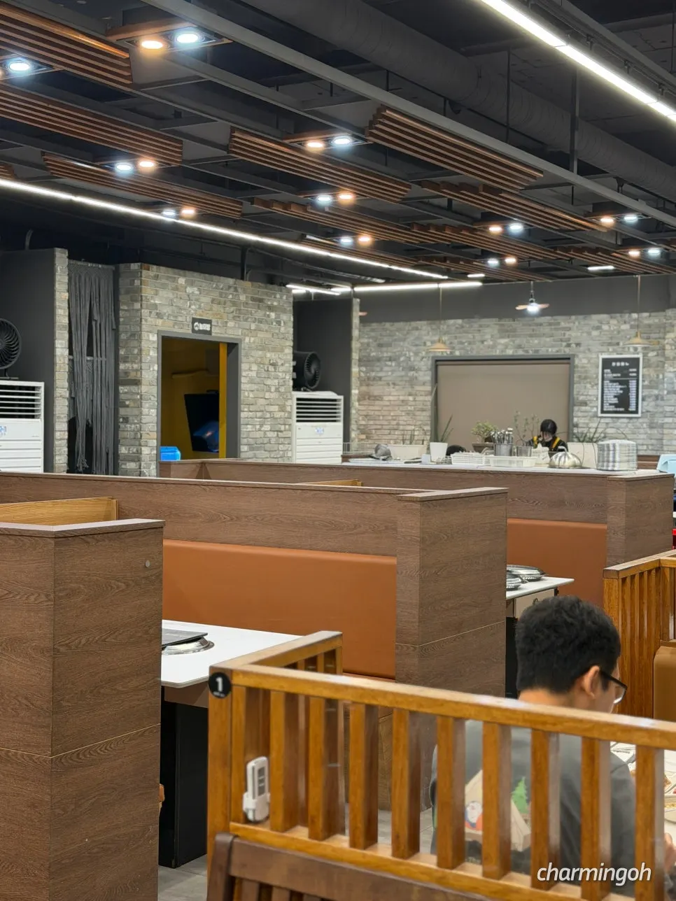 Spacious dining hall with generously spaced tables