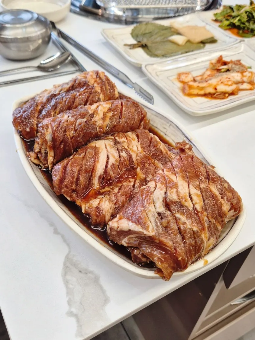 Jeongwon marinated grilled galbi cooking over charcoal