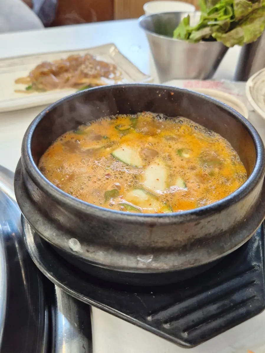 Doenjang stew and rice ordered alongside the meat