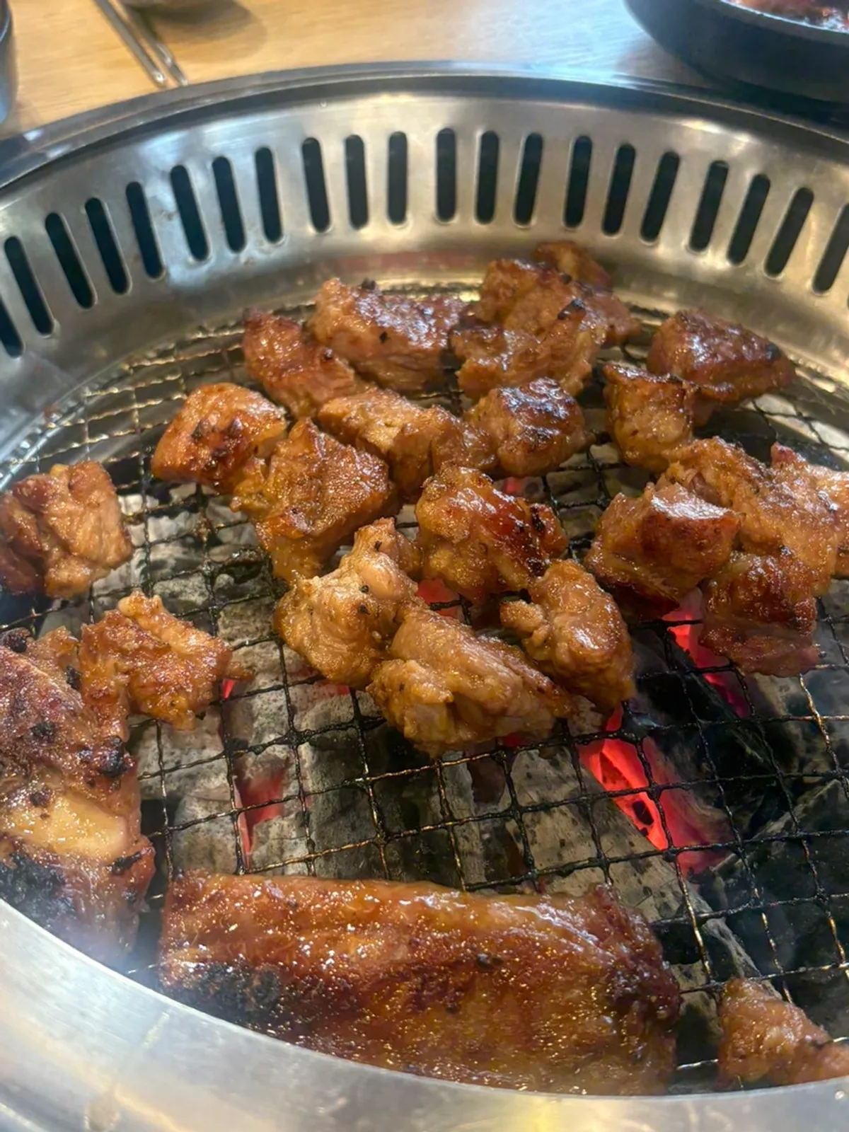 Thick pork galbi grilling on the pan