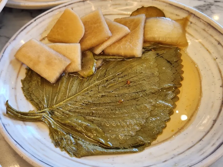 Side dish plates served alongside the meat