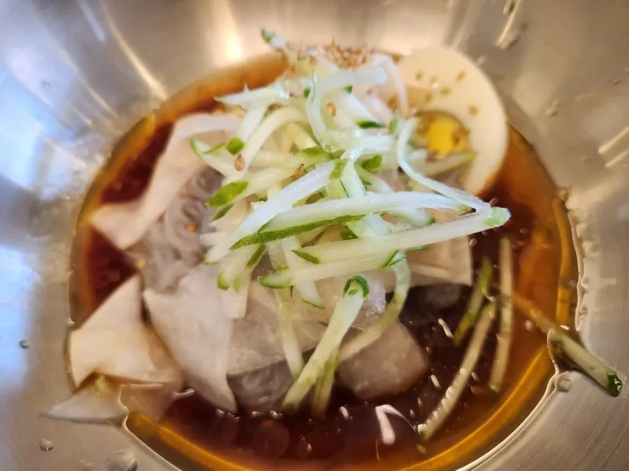 Bibim-naengmyeon topped with sauce