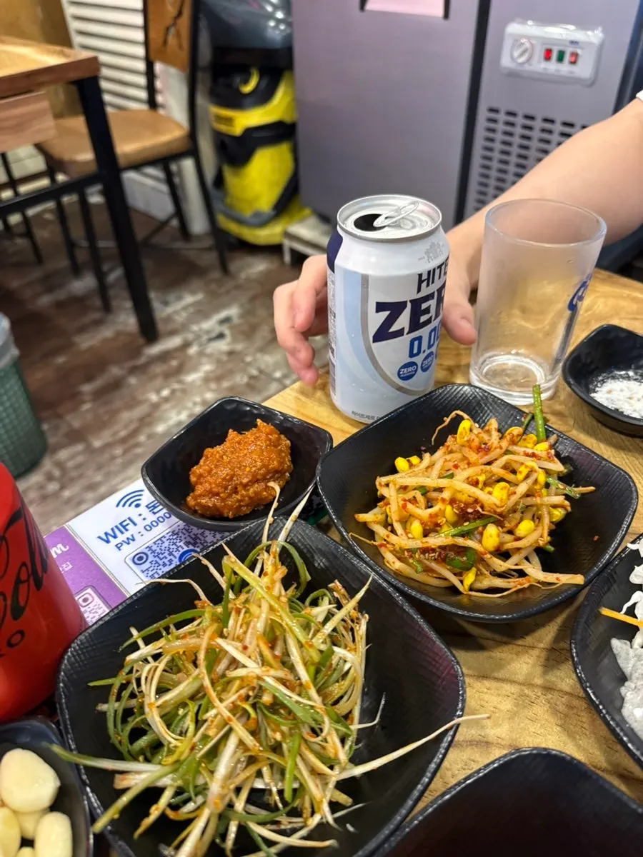 Table set with meat and zero-alcohol beer