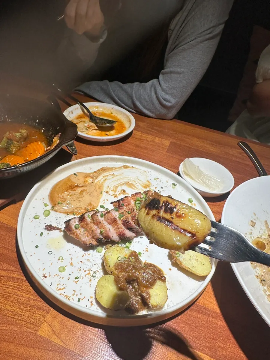 Potatoes served with the pork belly steak