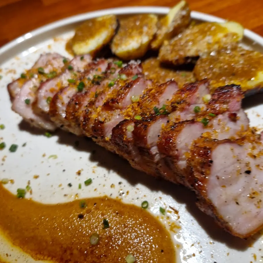A generous portion of Korean pork belly steak on the plate