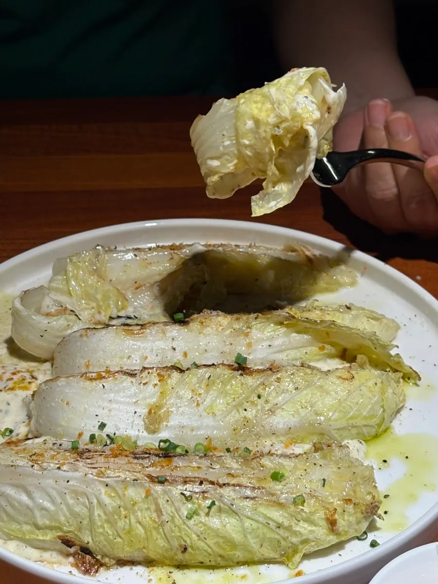Cross-section of grilled cabbage with sauce