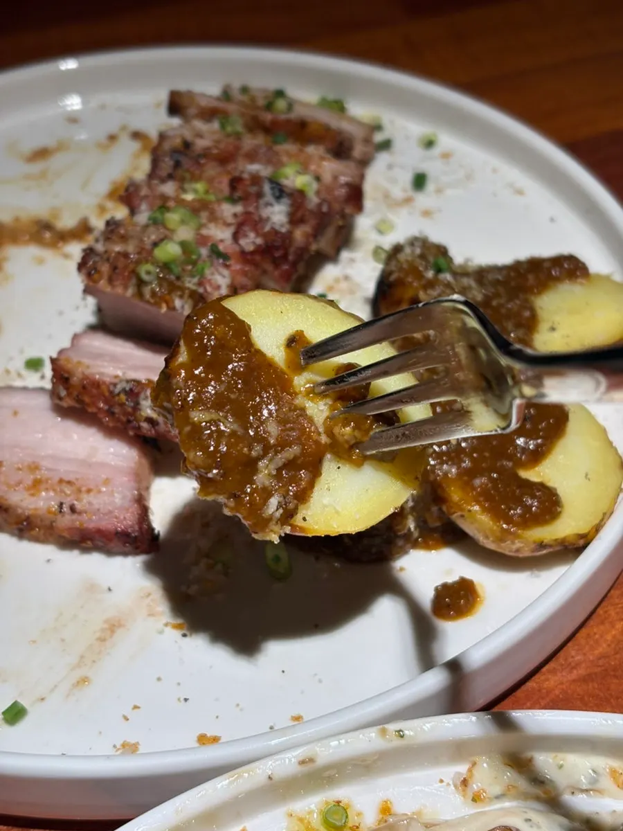 Grilled potatoes served with the steak