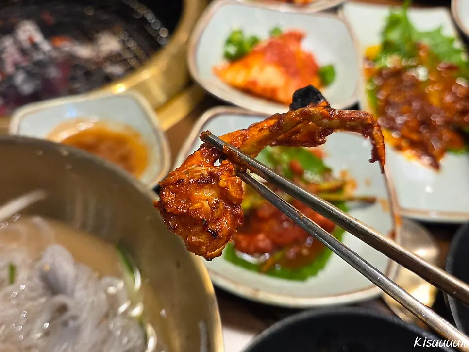 Green onion kimchi being grilled on the charcoal