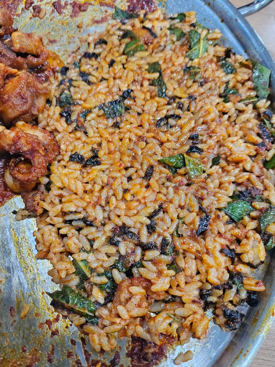 Cheese fried rice being stir-fried on the pan