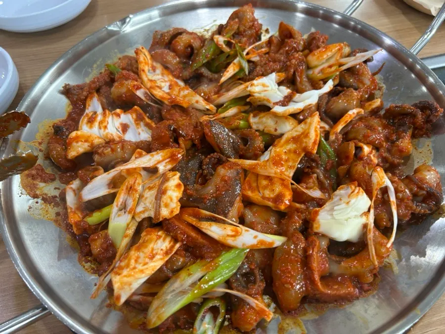 Jjukkumi stir-fry cooking, spread wide across the grill