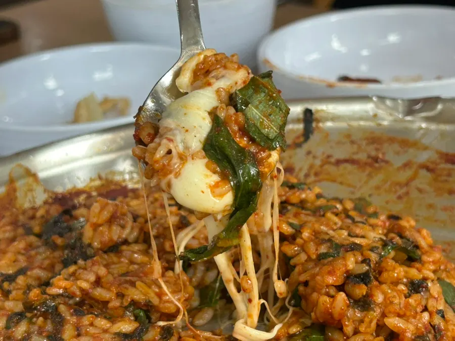 Cheese fried rice on the grill drizzled with perilla oil