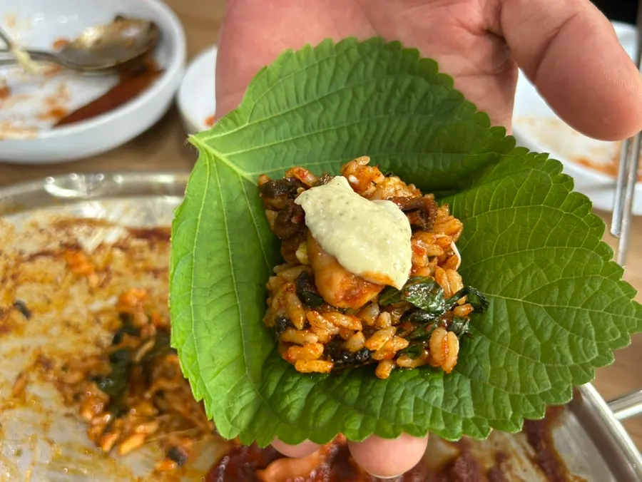 Cheese fried rice with melted cheese pulling and dripping