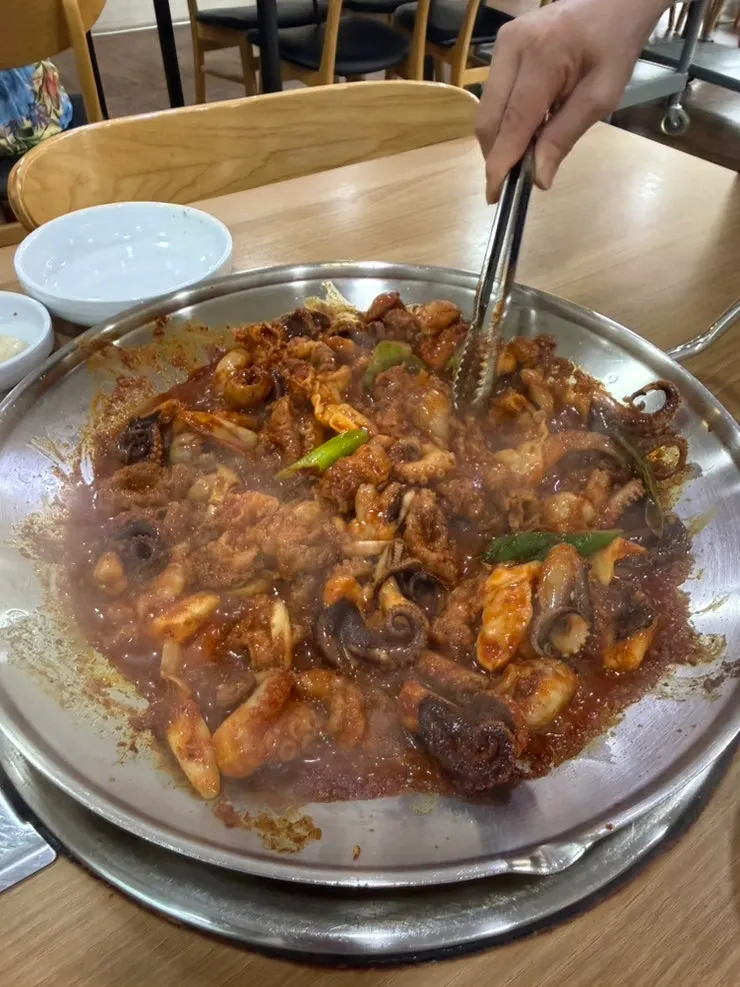 Cooked jjukkumi and thinly sliced pork belly